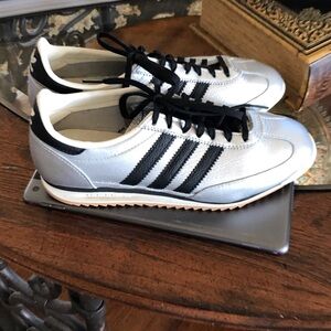 Adidas Women’s silver and black sneakers